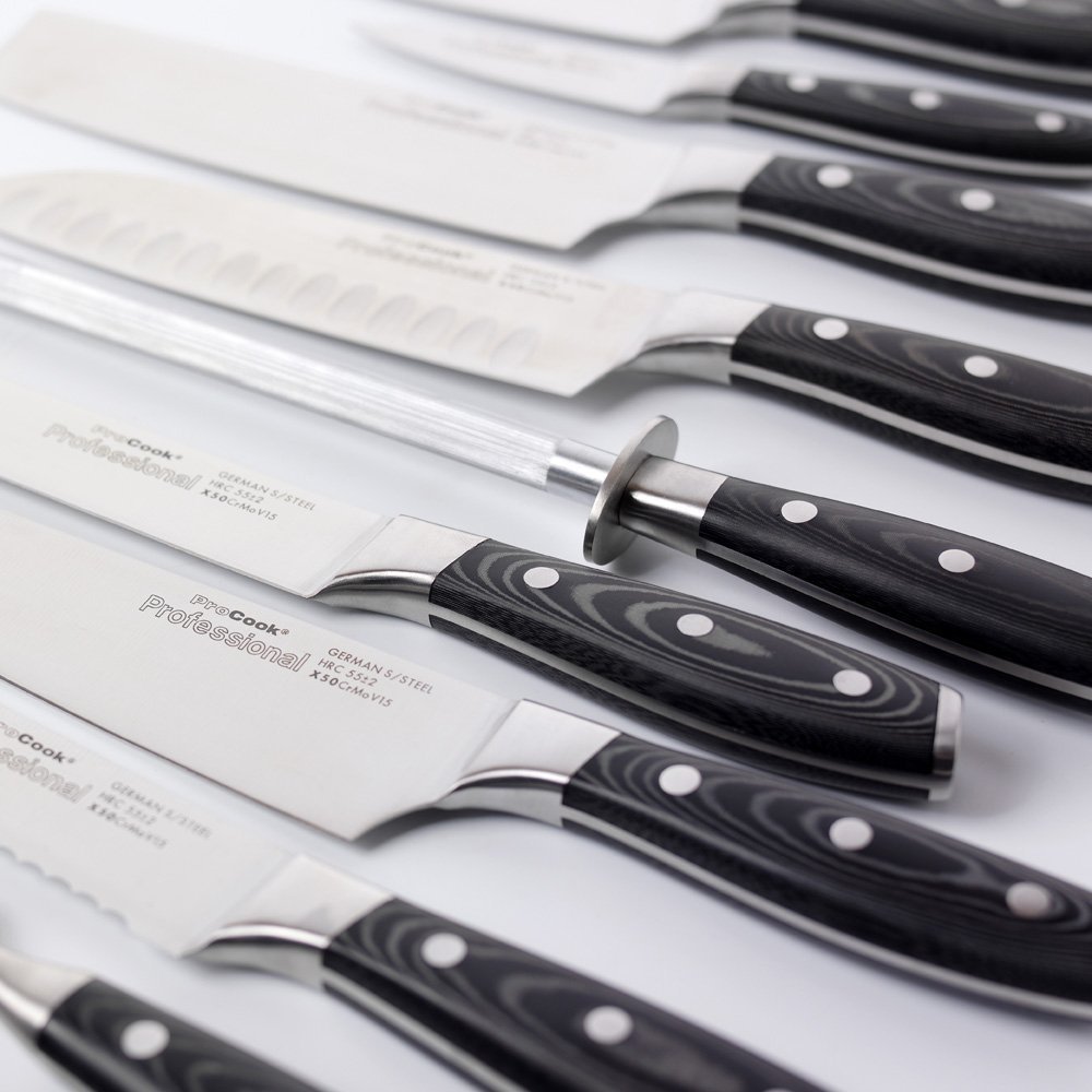 ProCook Professional Knives spread out on a table.